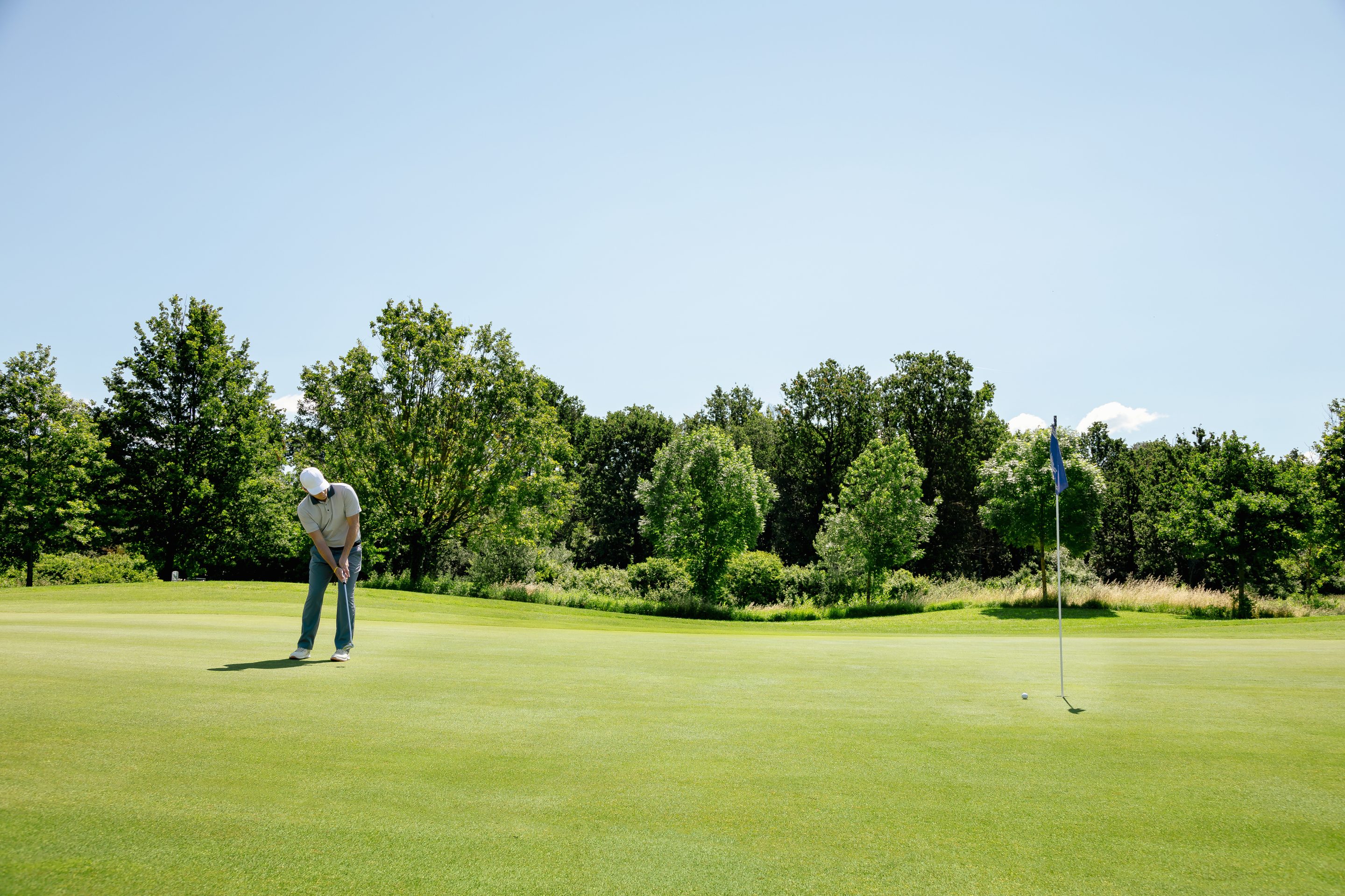 Man playing golf on golf course